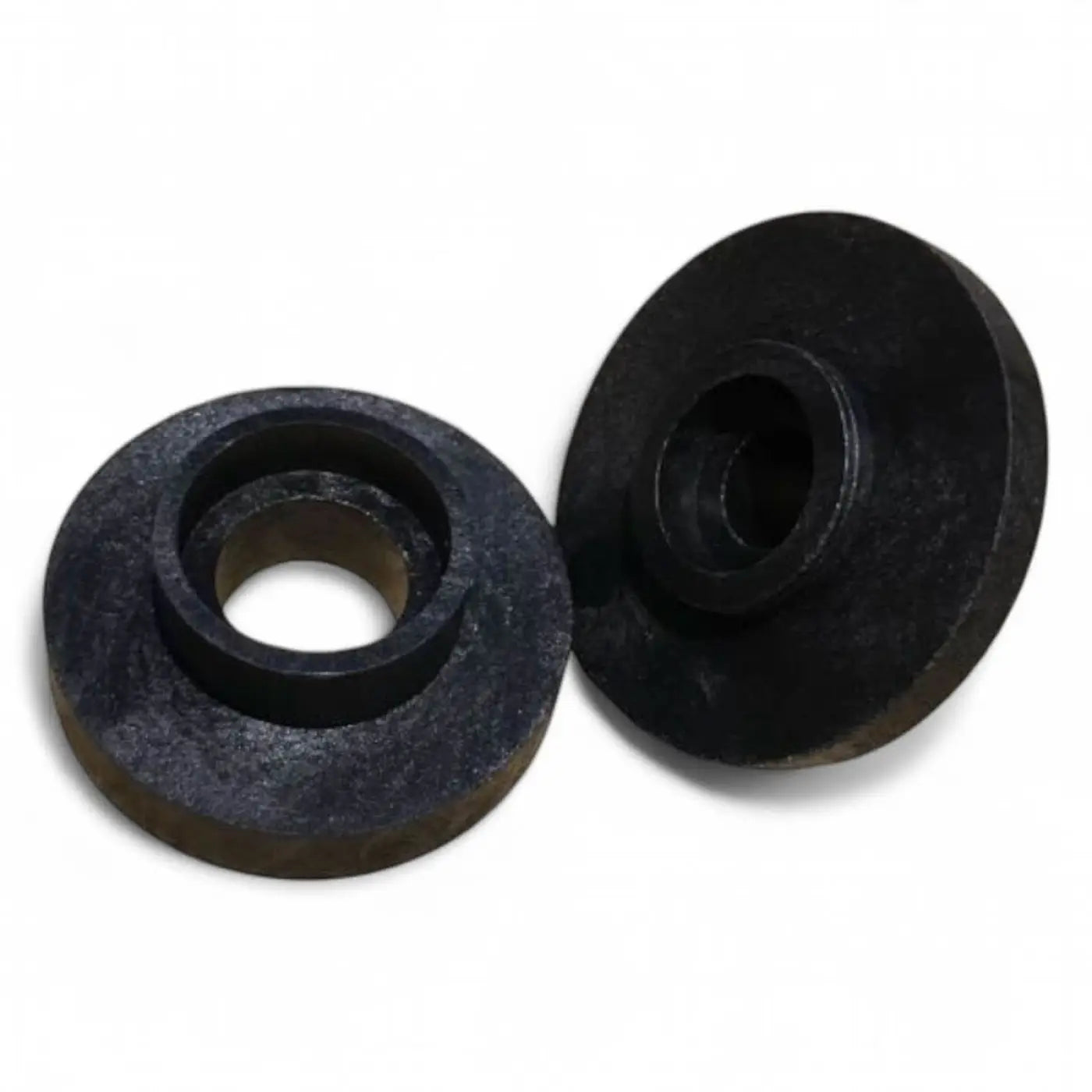 Schwarze runde metallische gardiner reinigungs-stopfen mit zentralem loch und strukturierter oberfläche