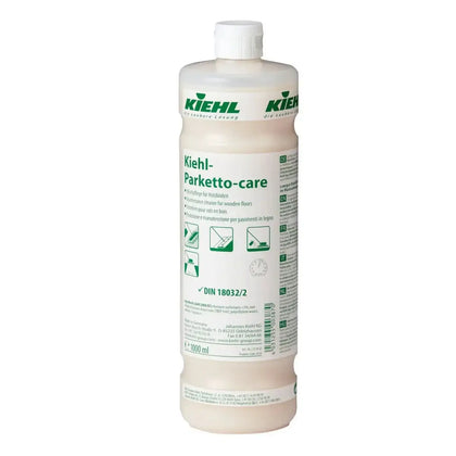 A translucent plastic bottle of kiehl parketto-care wischpflege for wooden floors with white cap and green black label
